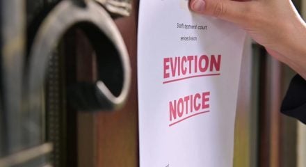 Close-up of a tenants eviction notice gluing to the door