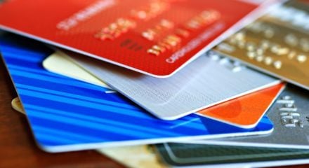 Stack of credit cards - combining credit card debt with mortgage
