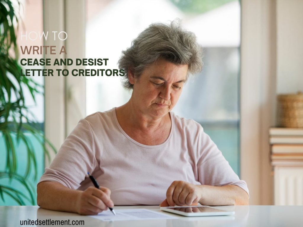 A woman writing a cease and desist letter to a creditor