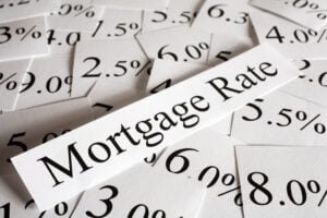 "mortgage rate" on piece of paper with various percentages on paper behind it