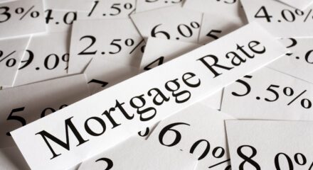 "mortgage rate" on piece of paper with various percentages on paper behind it