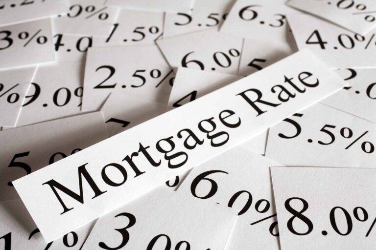 "mortgage rate" on piece of paper with various percentages on paper behind it