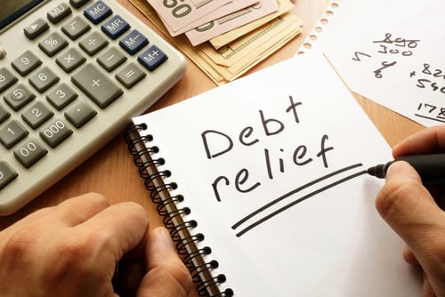 debt relief written on notepad