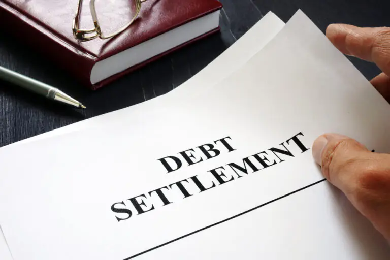 piece of paper with debt settlement typed on it